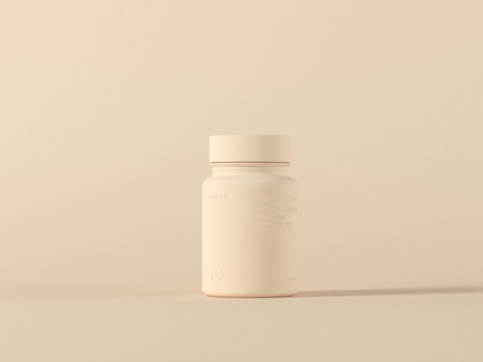 Photo by Anirudh a bottle of medicine sitting on top of a table