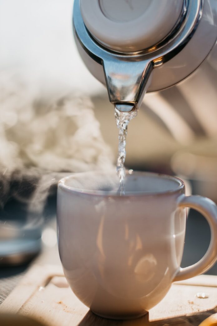 Photo by Redd Francisco a glass pouring water into a cup